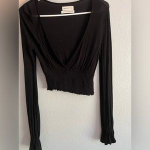 Cropped long sleeve deep plunge top